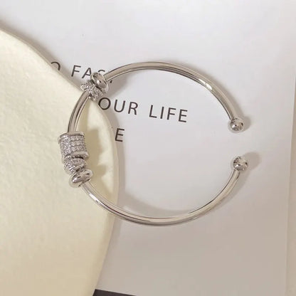 Esclave Dorada y Plateada