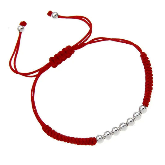 Pulsera Hilo Rojo con nudos y esferas plateadas